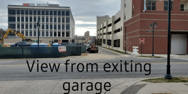 Street photo with the text “View From Exiting Garage”